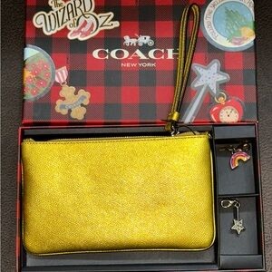 COACH limited edition Wizard of Oz yellow brick road wristlet w/charms